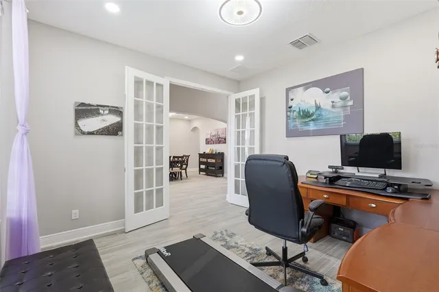 a bed room with furniture and a wooden floor