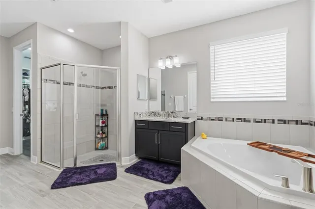 a view of a livingroom with furniture and a flat screen tv