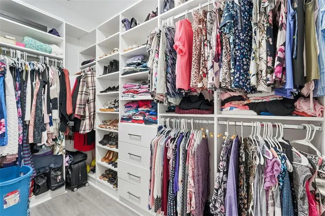 a bedroom with a bed and a night stand