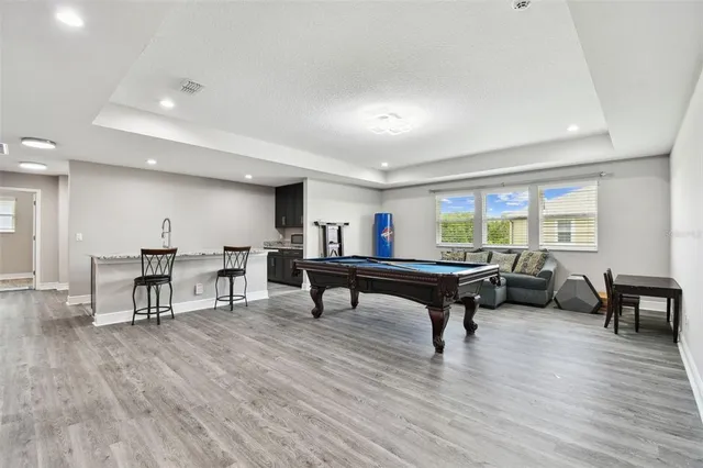 a view of a swimming pool with a patio