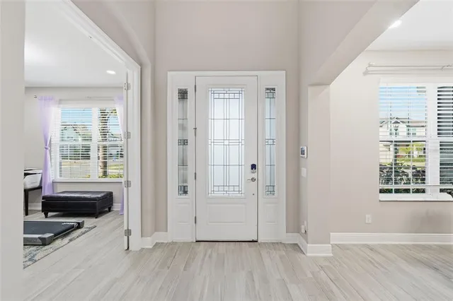 a kitchen with granite countertop white cabinets and stainless steel appliances