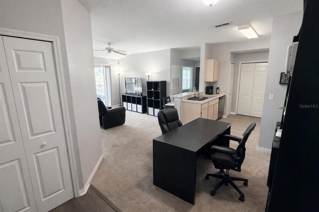 5483 Vineland Road, Unit 10301 Orlando, FL 32811 - Photo 3 of 13 a view of a living room and dining room