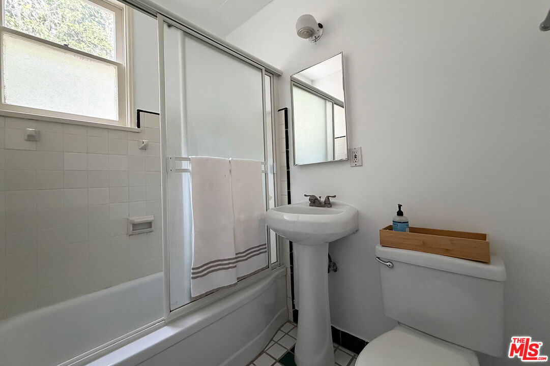 1701 Washington Avenue Santa Monica, CA 90403 - Photo 11 of 15 a bathroom with a sink toilet and shower