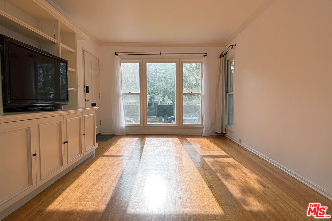 1701 Washington Avenue Santa Monica, CA 90403 - Photo 2 of 15 a view of an empty room with window and a kitchen view