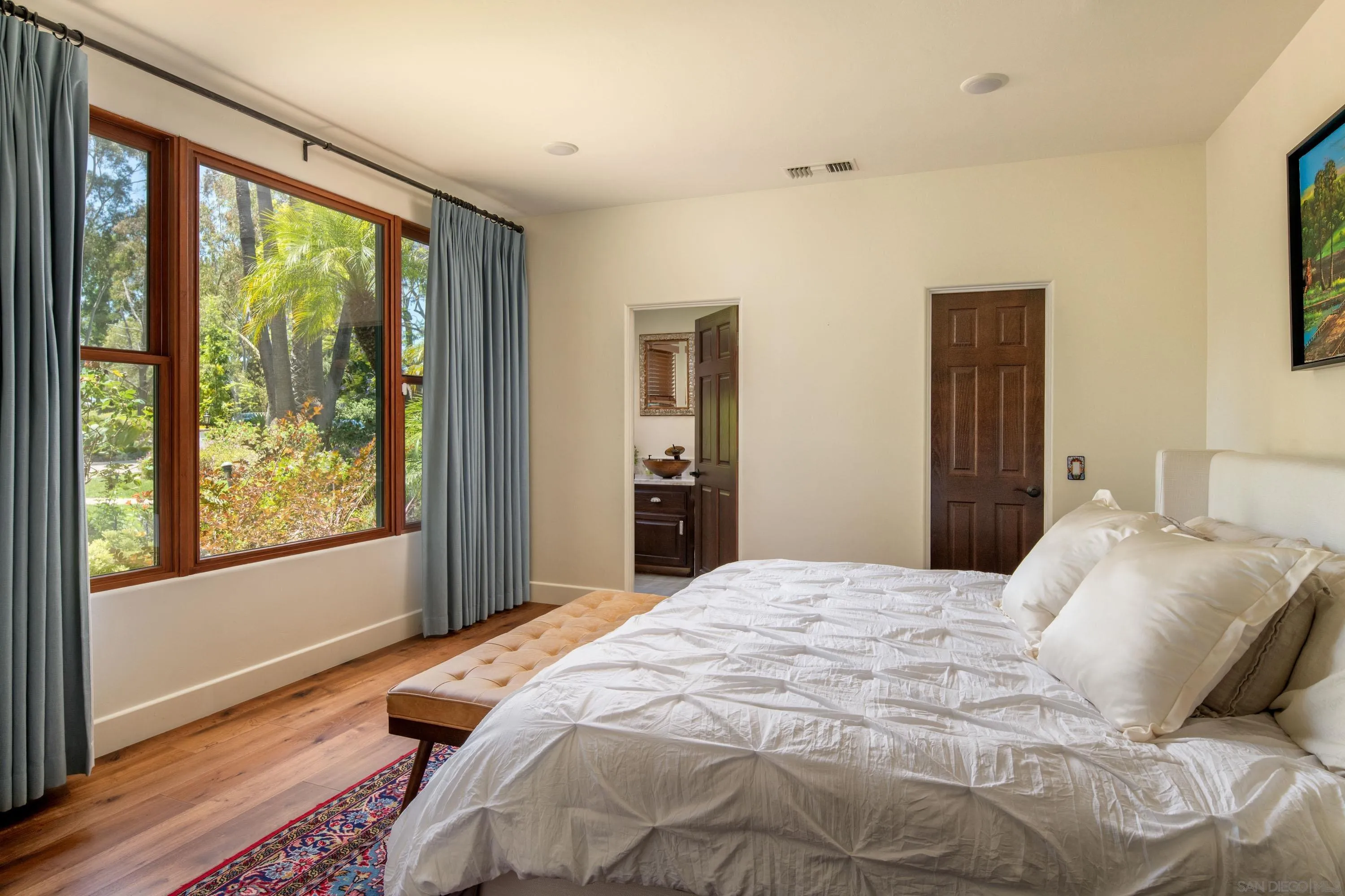 3028 Paseo Cielo Rancho Santa Fe, CA 92024 - Photo 25 of 50 a bedroom with a bed and wooden floor