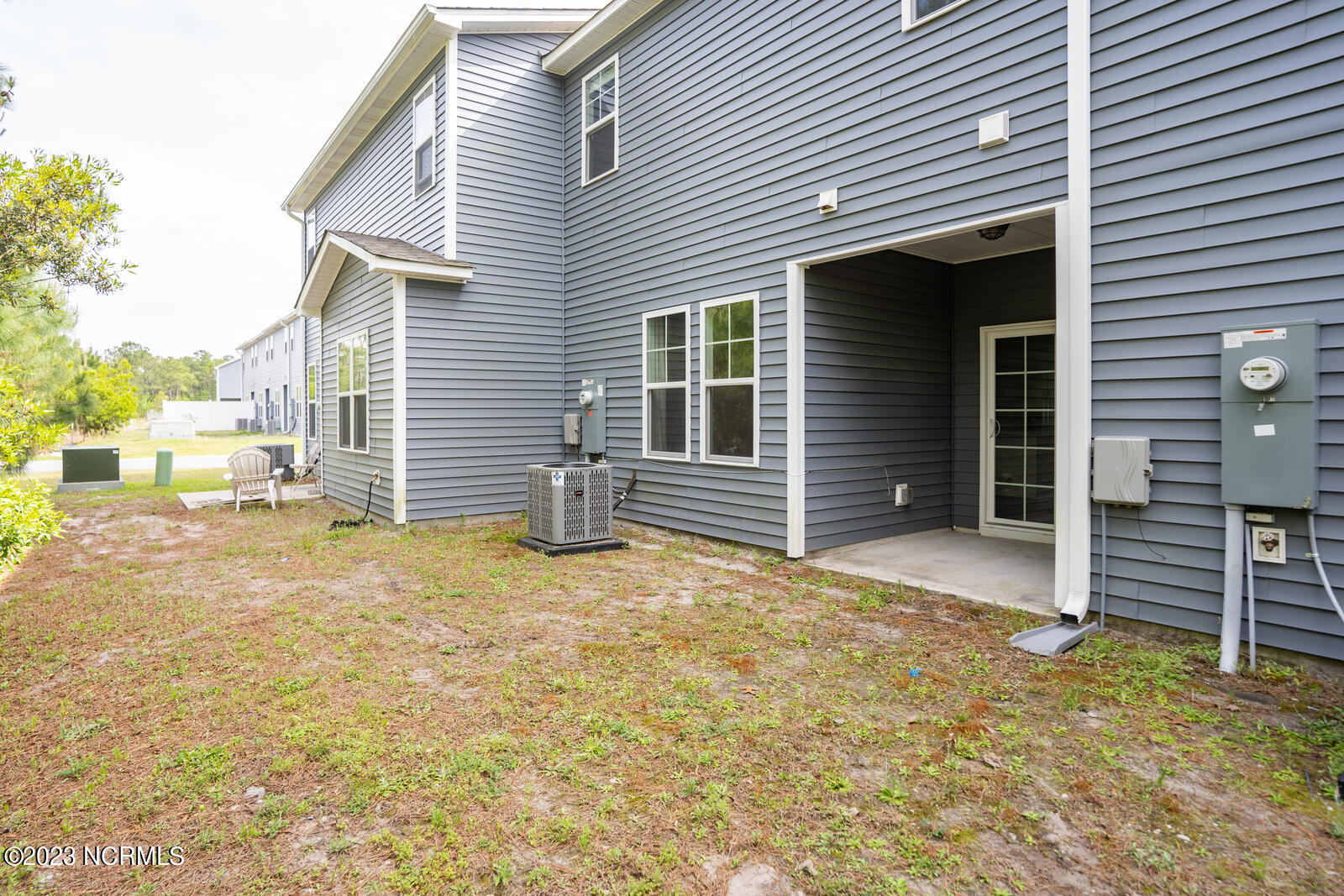 202 North Stingray Lane Holly Ridge, NC 28445 - Photo 26 of 34 Space Behind Back Patio