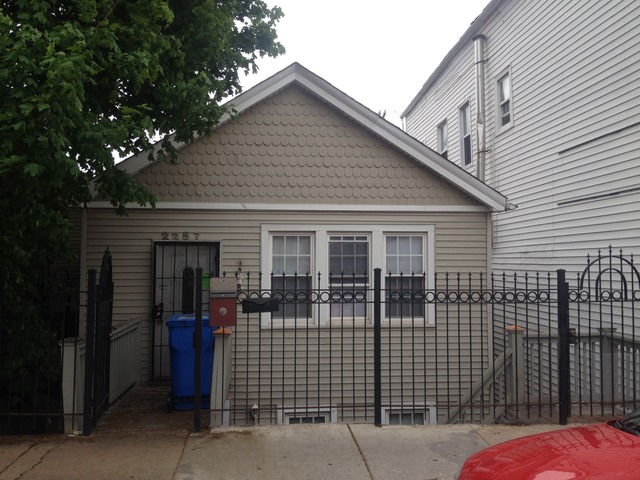 2257 West Cermak Road Chicago, IL 60608 - Photo 1 of 1 a front view of a house with glass windows