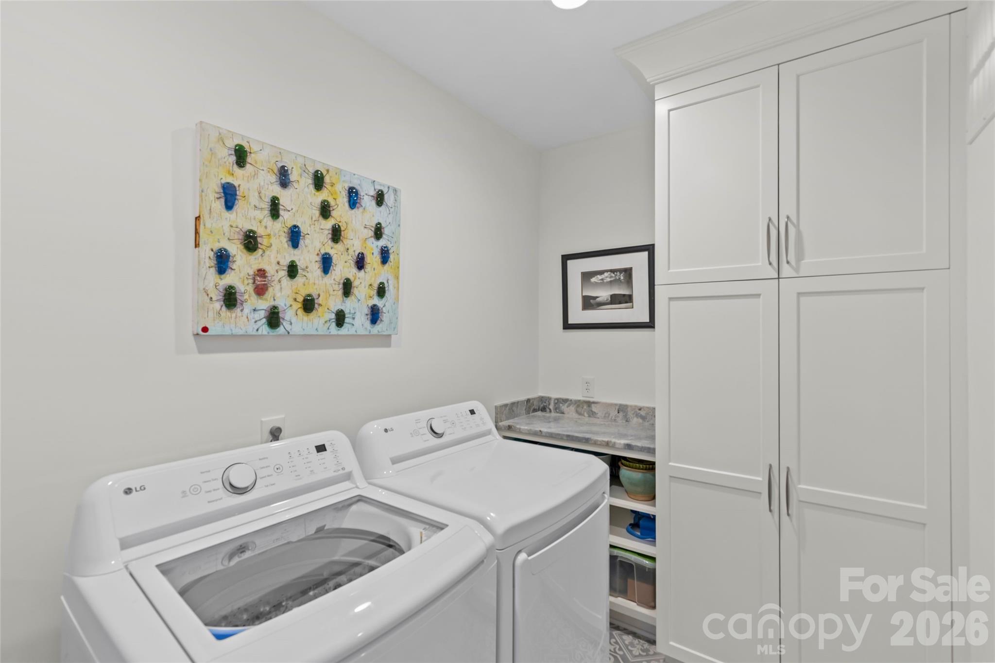 1500 Queens Road, Unit 104 Charlotte, NC 28207 - Photo 21 of 41 a utility room with dryer and washer