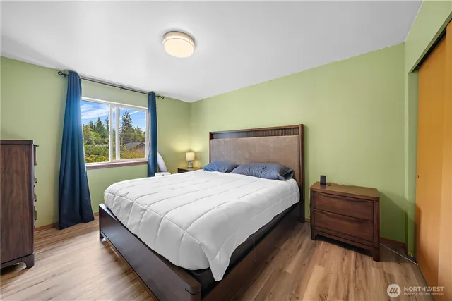 a bedroom with a bed and window