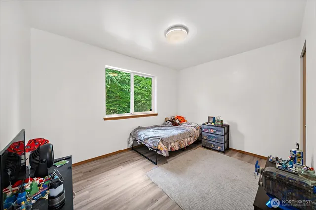 a bedroom with bed and a window