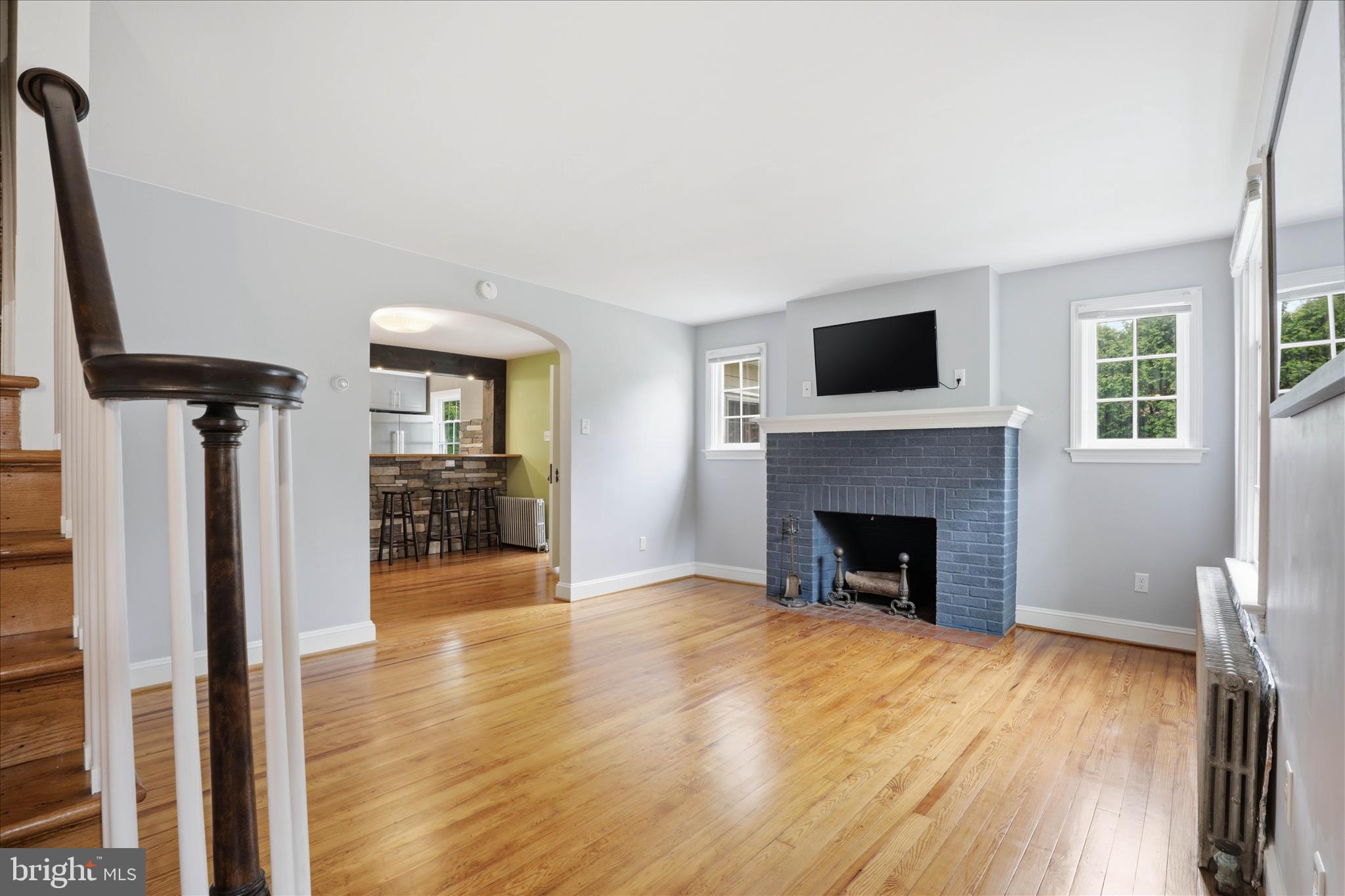 169 School House Road Lancaster, PA 17603 - Photo 4 of 39 a view of a livingroom with a fireplace a ceiling fan and windows