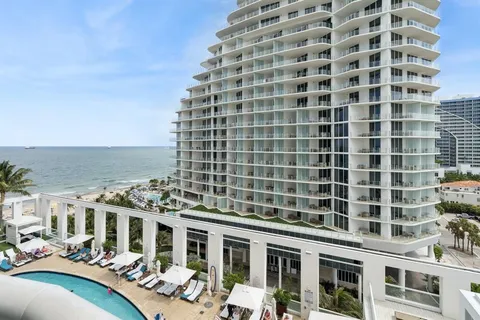 a front view of a building with outdoor seating