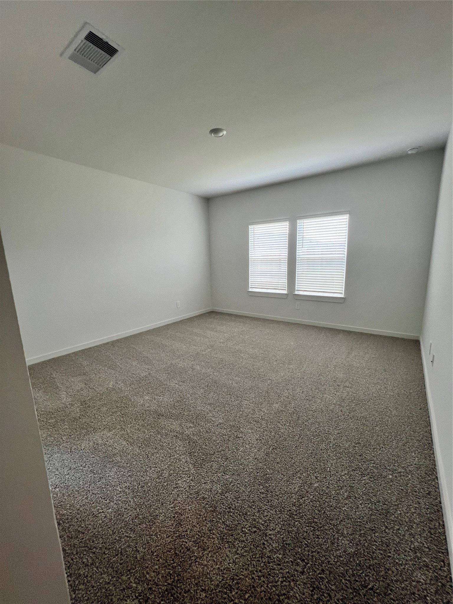 3811 Winterbourne Way Fulshear, TX 77441 - Photo 11 of 22 an empty room with windows