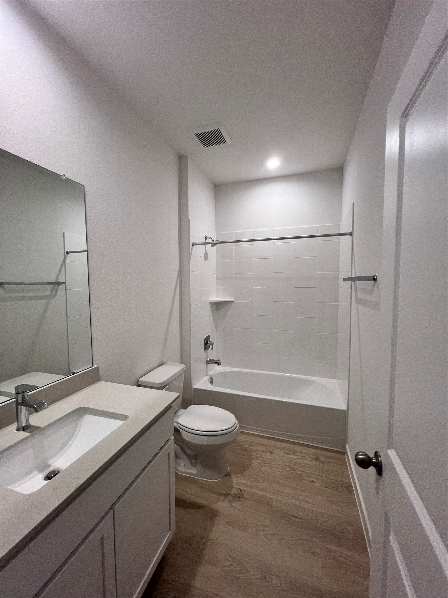 3811 Winterbourne Way Fulshear, TX 77441 - Photo 16 of 22 a bathroom with a granite countertop sink toilet and shower