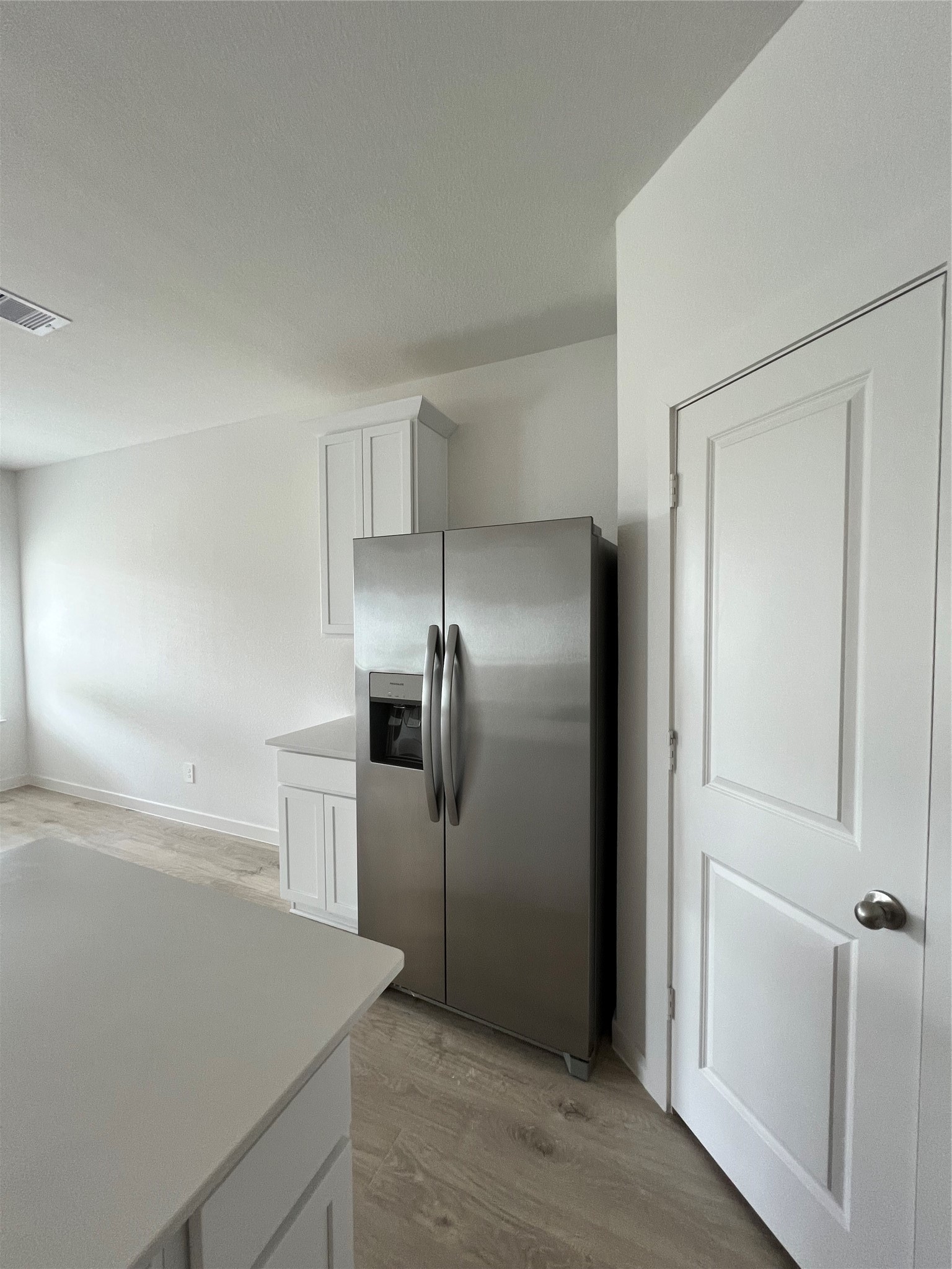 3811 Winterbourne Way Fulshear, TX 77441 - Photo 7 of 22 a kitchen with a refrigerator and a sink