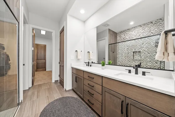 a kitchen with granite countertop white cabinets and stainless steel appliances