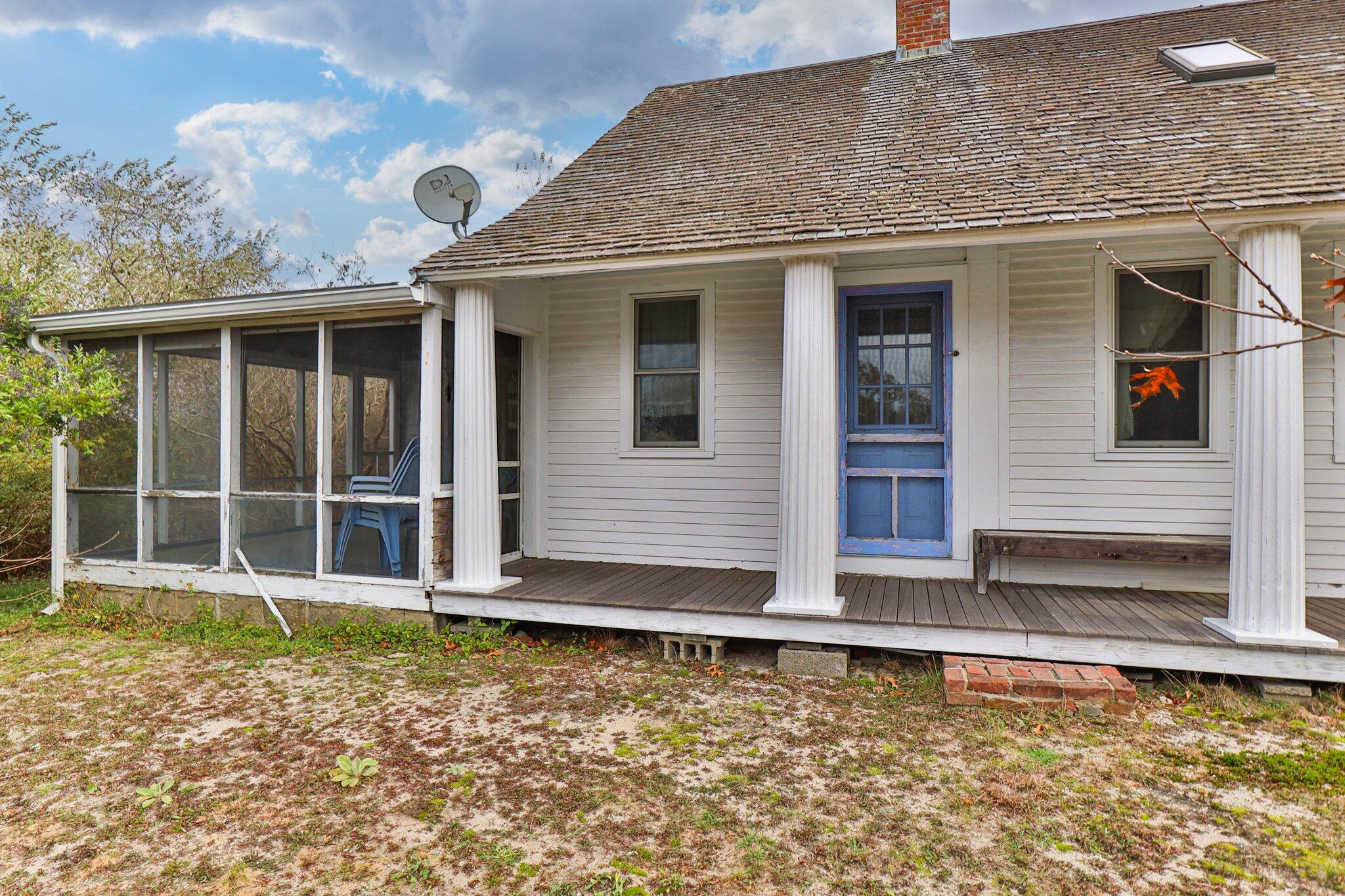 10 Perrys Hill Way Truro, MA 02666 - Photo 1 of 33 a front view of a house with a yard