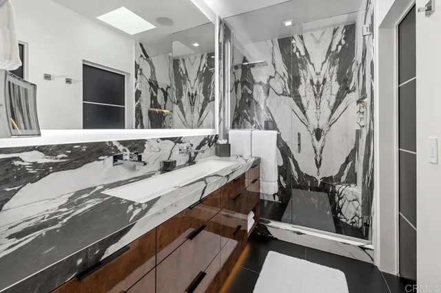 a view of a patio with table and chairs a barbeque with wooden floor and fence