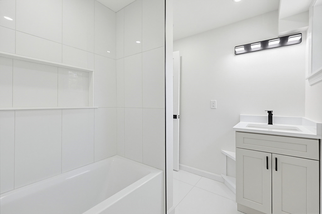 175 Pleasant Street Upton, MA 01568 - Photo 33 of 39 a bathroom with a bathtub and a sink