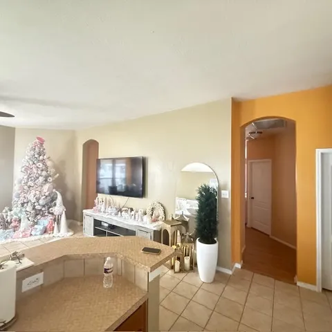 a living room with furniture and white walls