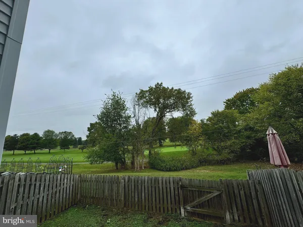 a view of a deck with a yard