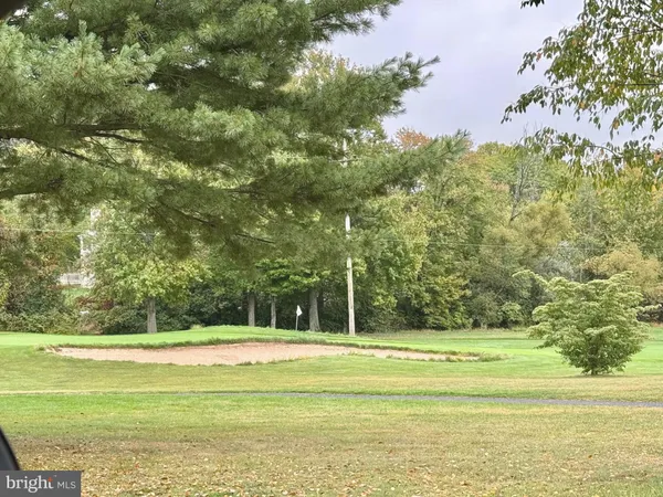 a view of a swimming pool with an outdoor space and seating area
