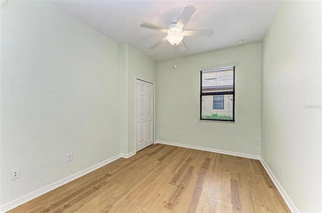 an aerial view of a house with a yard and lake view