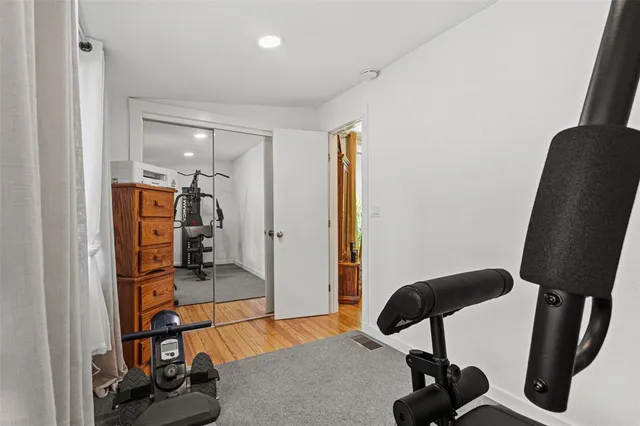 a bedroom with furniture and a window