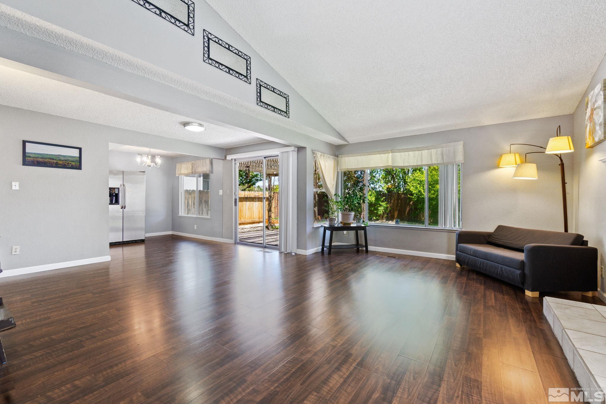 6187 White Water Way Reno, NV 89523 - Photo 5 of 33 a view of a livingroom with furniture wooden floor and windows