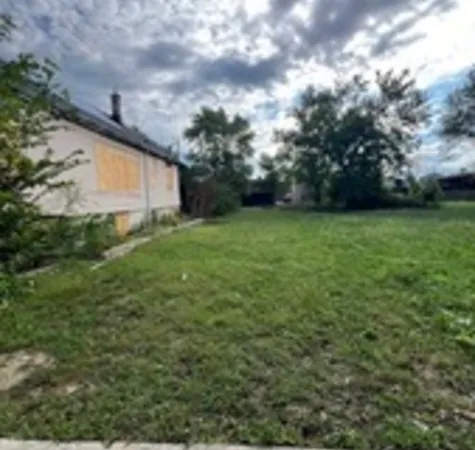 a backyard of a house with lots of green space