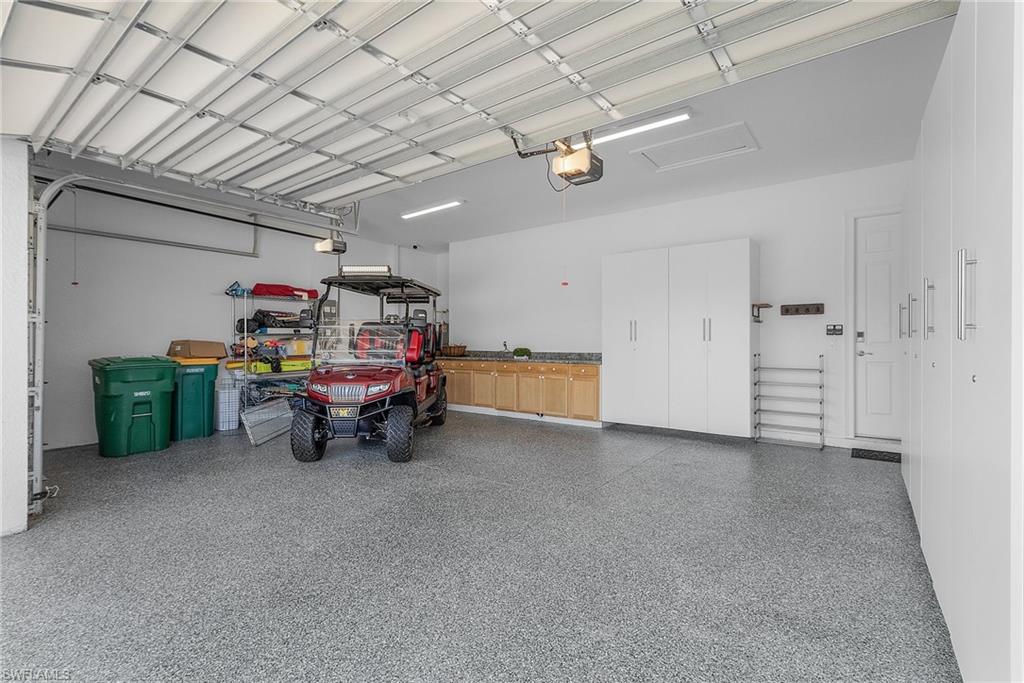 14539 Kelson Circle Naples, FL 34114 - Photo 28 of 37 3 Car Garage with storage and work bench
