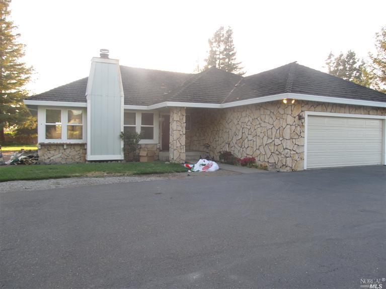 441 Sierra Vista Road Santa Rosa, CA 95401 - Photo 1 of 1 a front view of a house with a yard and garage