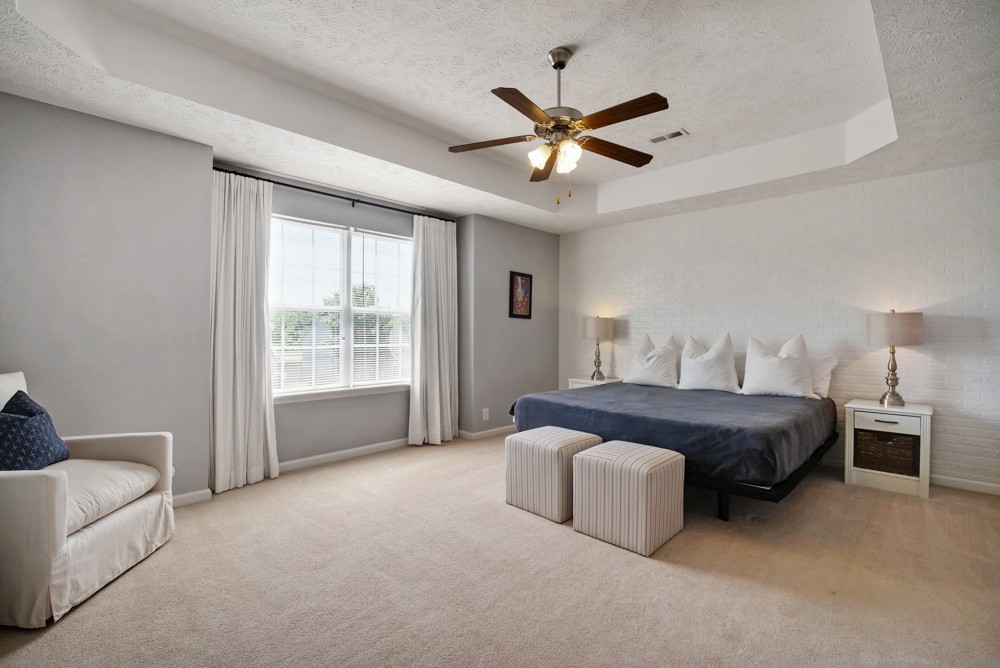 1030 Woodall Road Lebanon, TN 37090 - Photo 14 of 27 a spacious bedroom with a bed and a chandelier