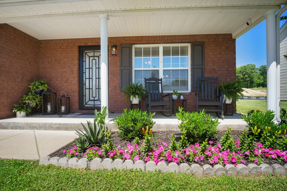 1030 Woodall Road Lebanon, TN 37090 - Photo 3 of 27 a view of a potted plant sitting in front of a house