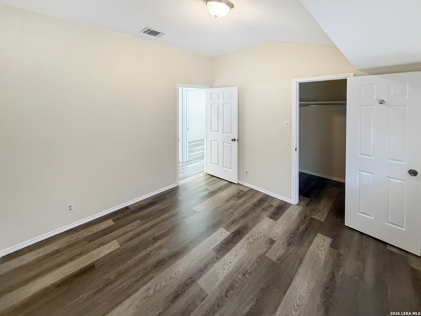 9808 Delta Ridge Drive Converse, TX 78109 - Photo 13 of 38 a view of a room with wooden floor and doors