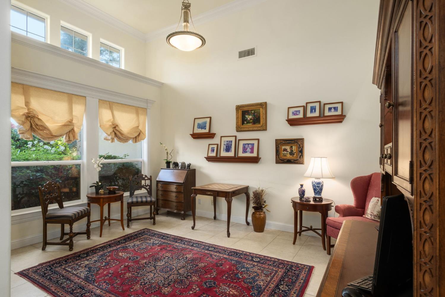 3386 East Vía Monte Verdi Clovis, CA 93619 - Photo 14 of 51 a living room with furniture wooden floor and a table