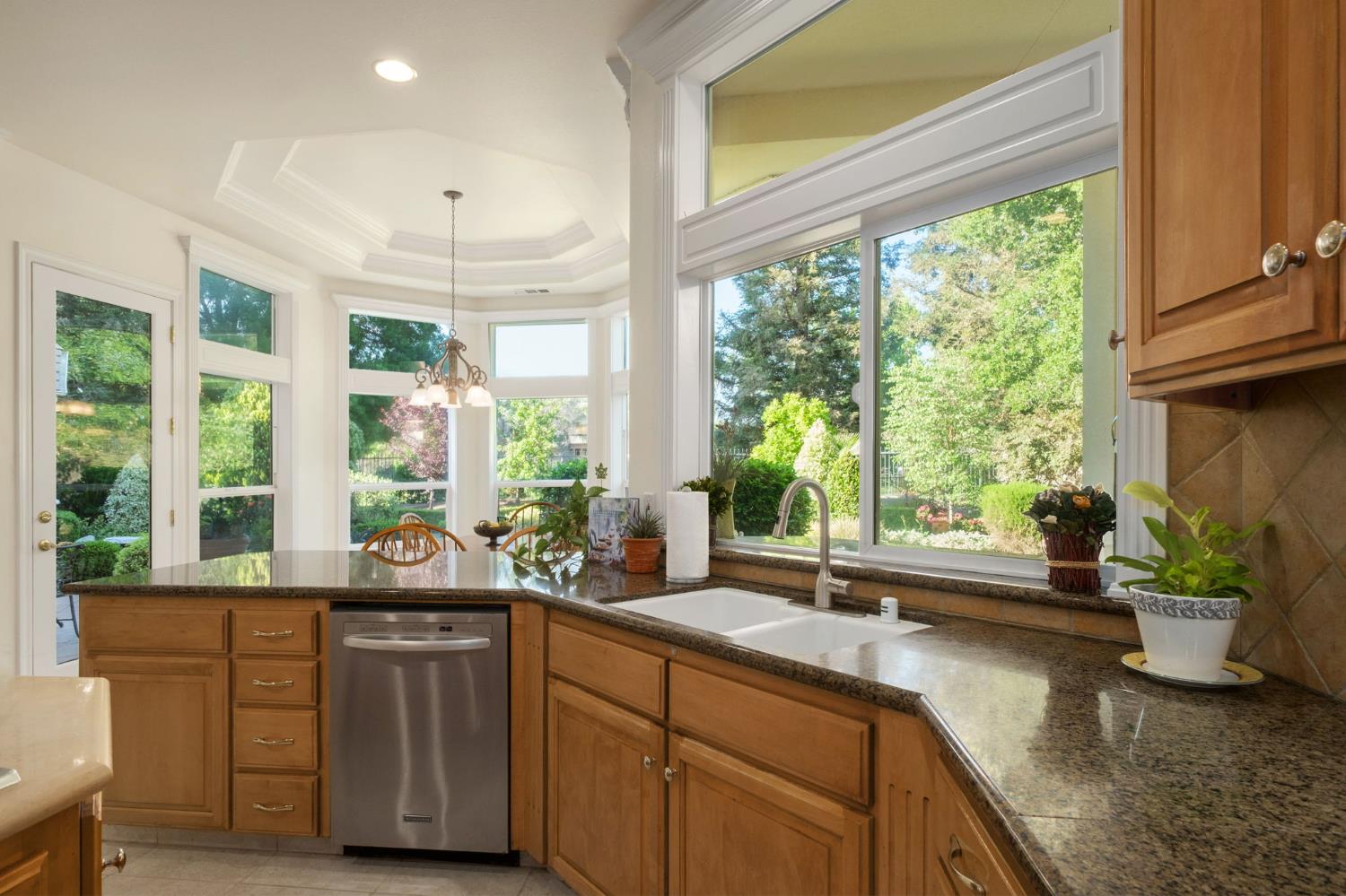 3386 East Vía Monte Verdi Clovis, CA 93619 - Photo 16 of 51 a kitchen with sink and large window