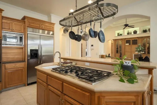 a kitchen with a stove and a refrigerator