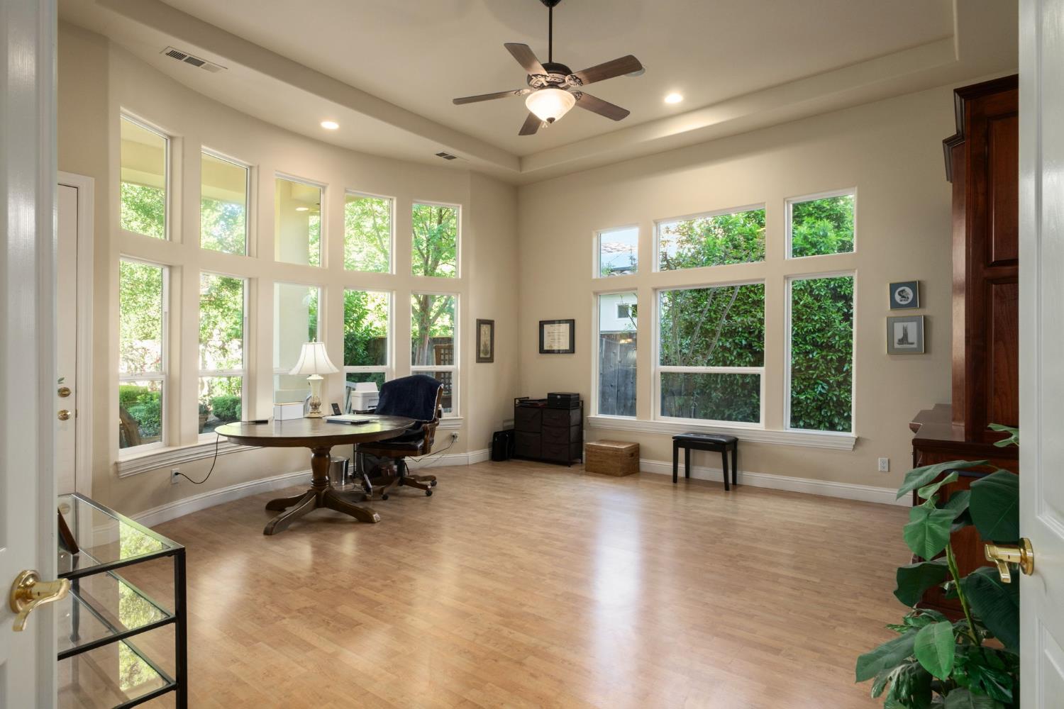 3386 East Vía Monte Verdi Clovis, CA 93619 - Photo 22 of 51 a living room with furniture and a large window