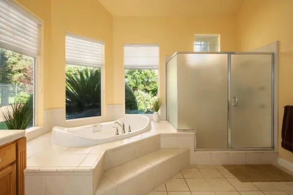 a bathroom with a bathtub and shower