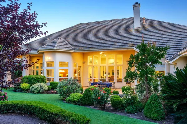 a front view of a house with a yard