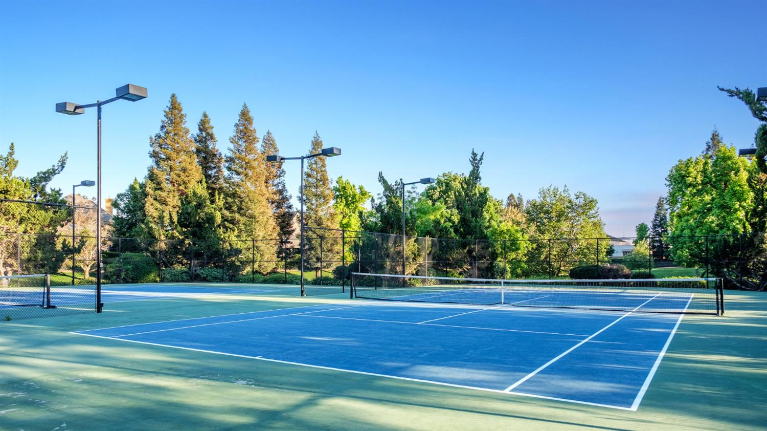 3386 East Vía Monte Verdi Clovis, CA 93619 - Photo 48 of 51 a view of a tennis court