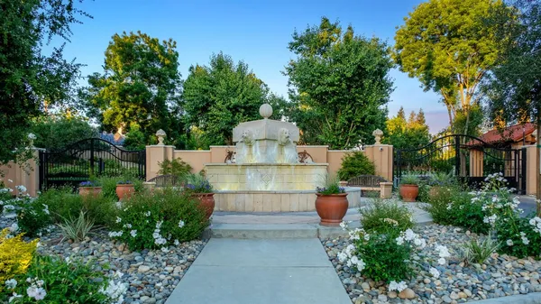 a view of a garden with sitting area