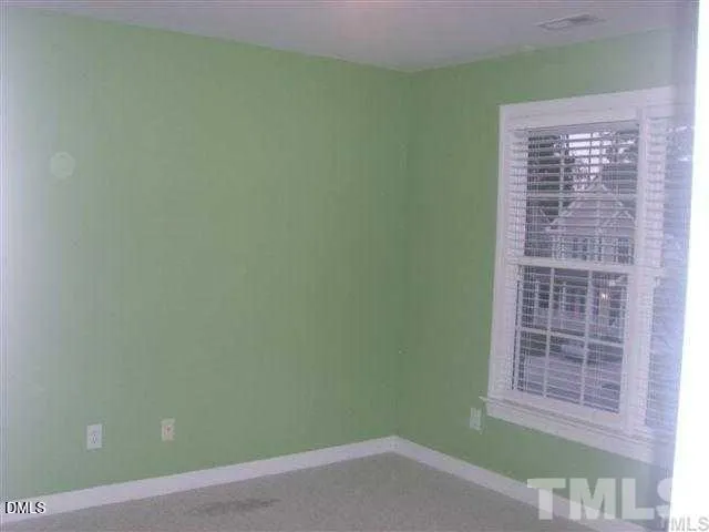 a view of empty room with windows