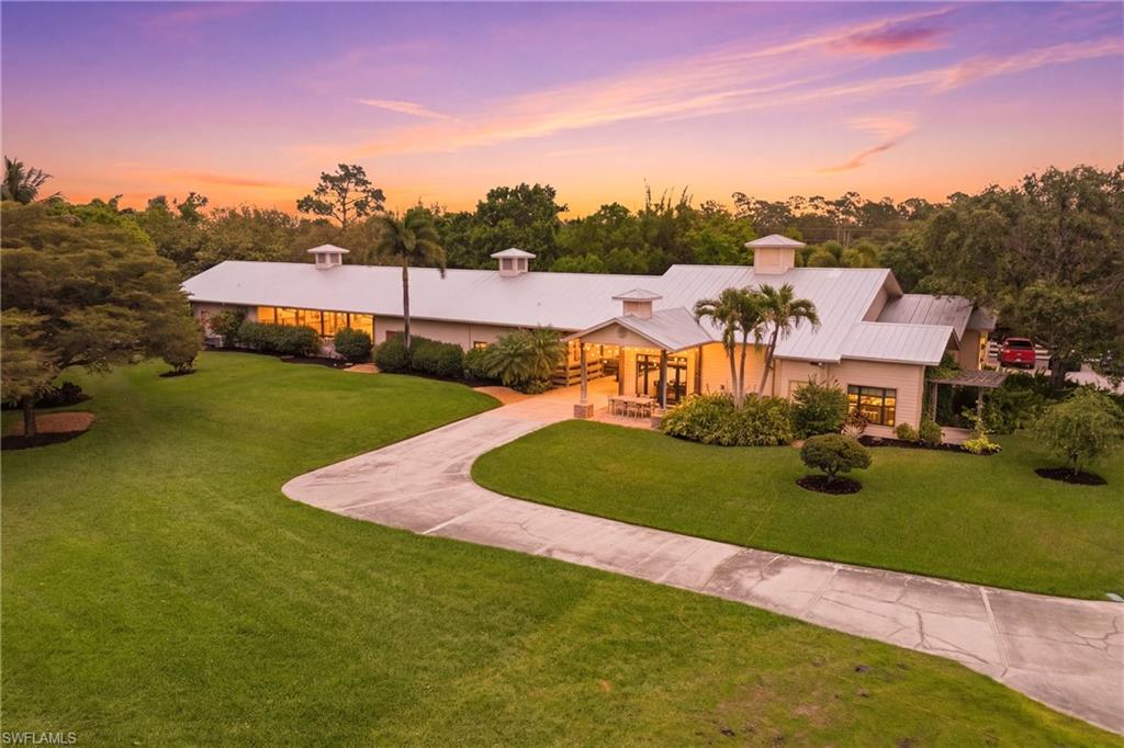 an aerial view of a house with garden space and street view