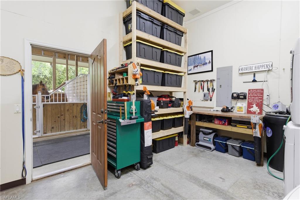 3800 Staley Road Fort Myers, FL 33905 - Photo 19 of 50 a room with furniture and a book shelf