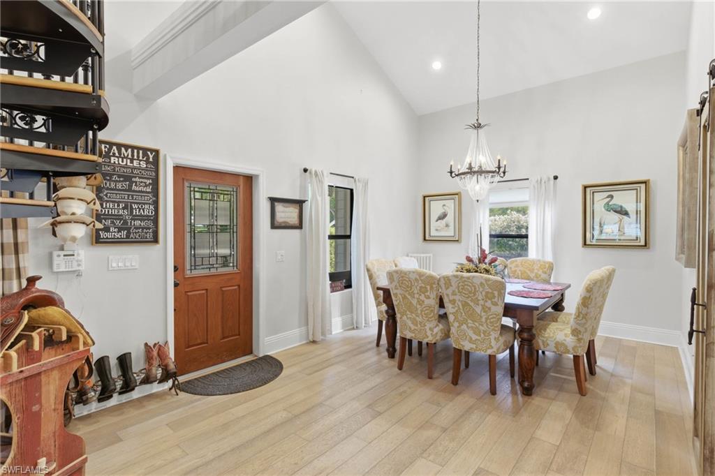3800 Staley Road Fort Myers, FL 33905 - Photo 25 of 50 a view of a dining room with furniture and wooden floor