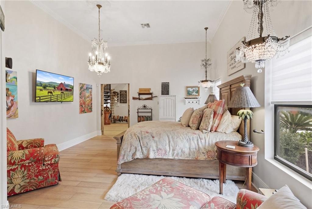 3800 Staley Road Fort Myers, FL 33905 - Photo 33 of 50 a bedroom with furniture and a chandelier