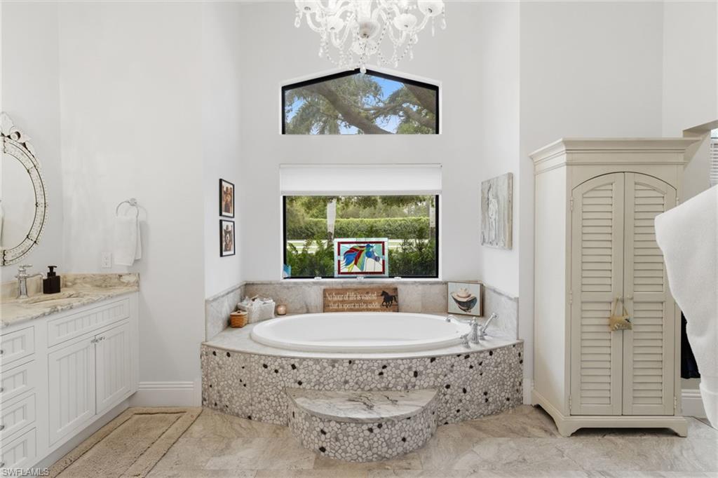 3800 Staley Road Fort Myers, FL 33905 - Photo 34 of 50 a spacious bathroom with a toilet a sink and a mirror