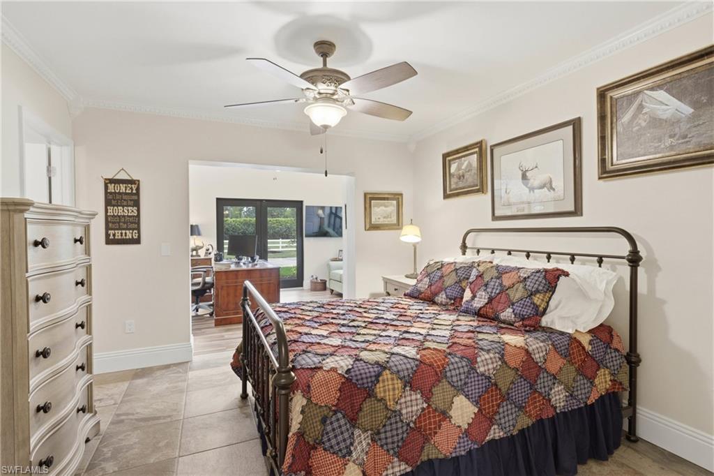 3800 Staley Road Fort Myers, FL 33905 - Photo 36 of 50 a bedroom with a bed and a chandelier